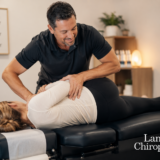 Chiropractor performing a side posture adjustment