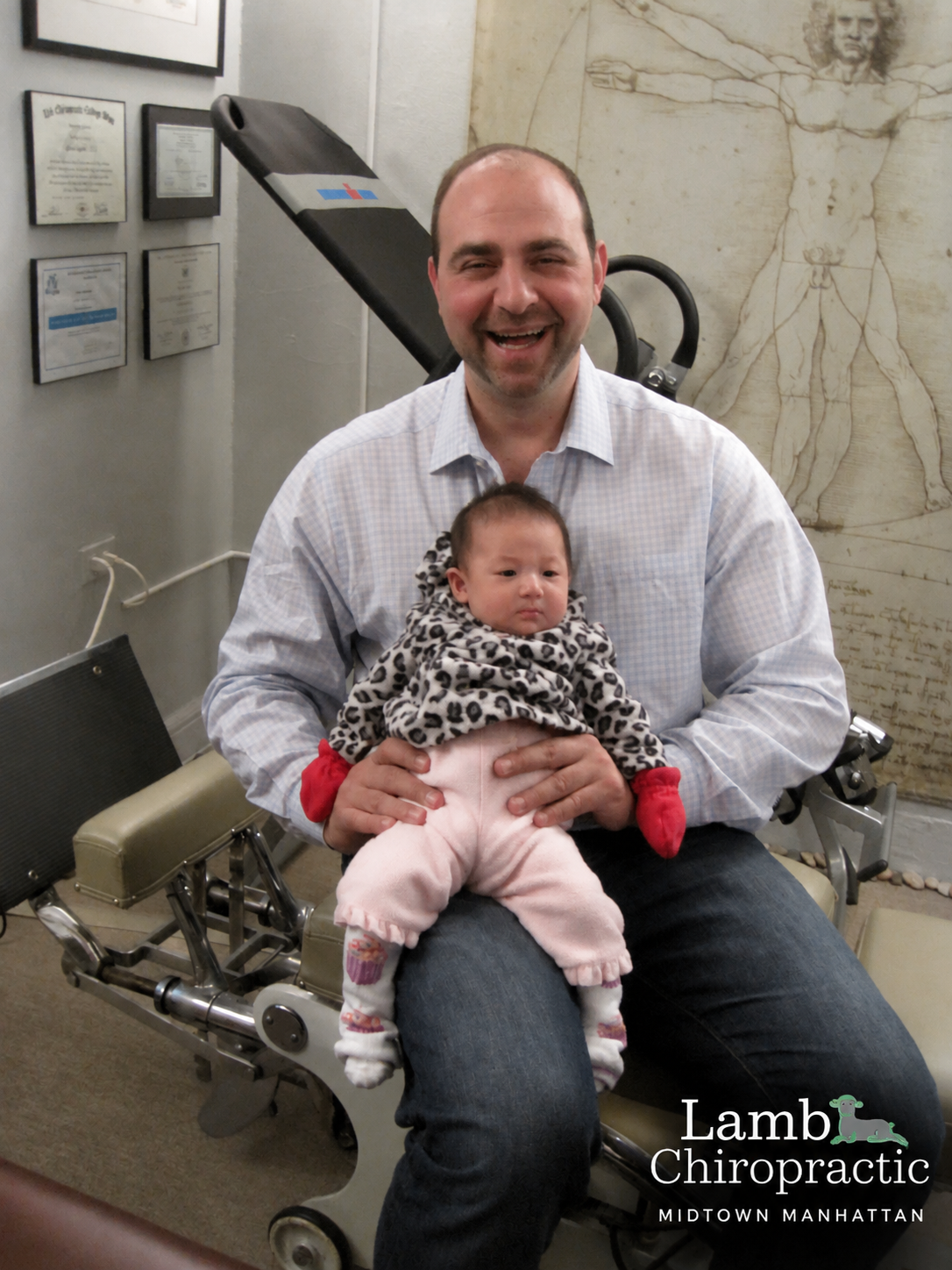 Another happy baby in the office to have it's spine checked.